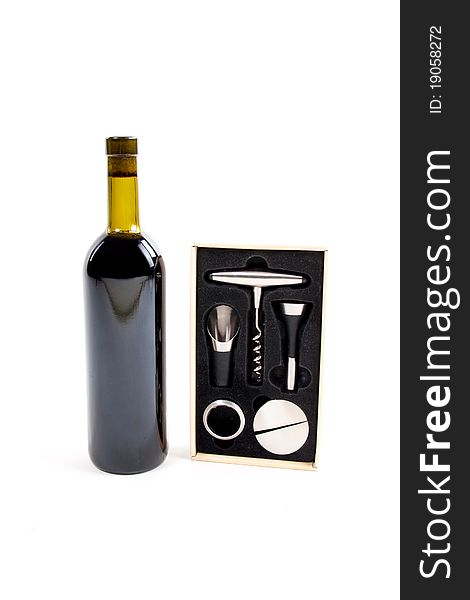 Red wine bottle over white with corkscrew