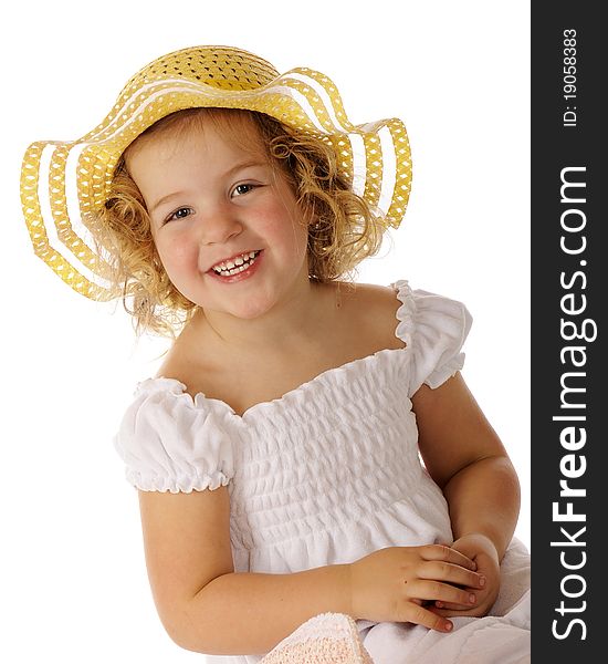 A beautiful preschooler in a white sundress and bright yellow hat. A beautiful preschooler in a white sundress and bright yellow hat.