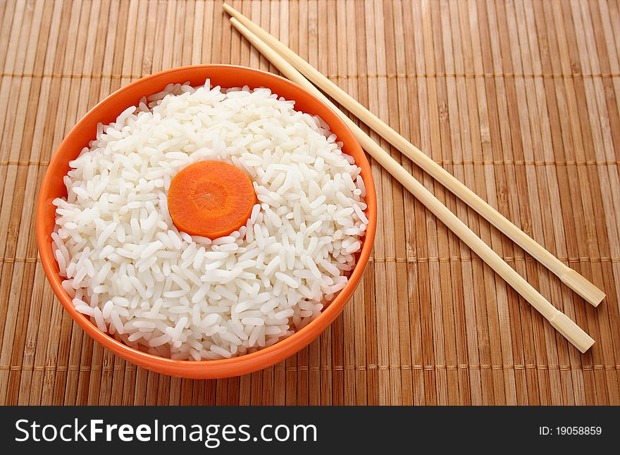 Rice And A Slice Of Carrot As A Flag Of Japan.