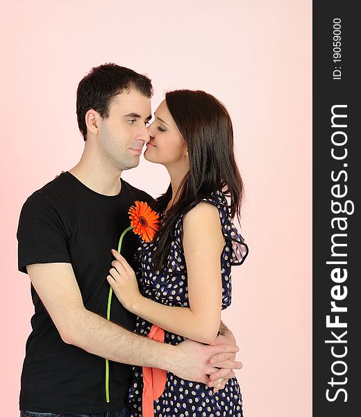 Lovely romantic couple with flower embracing. Lovely romantic couple with flower embracing