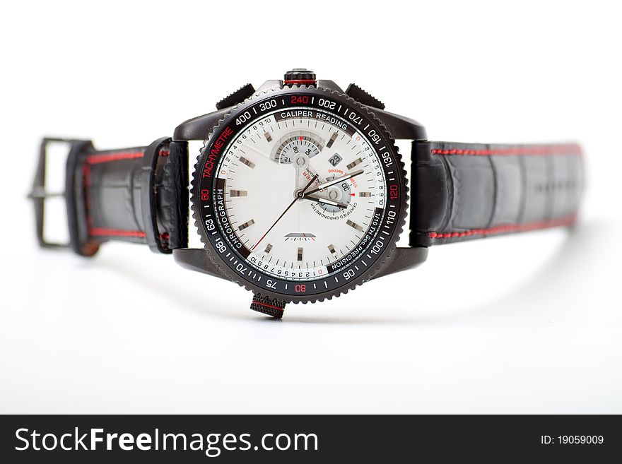 Men's black wristwatch on the white