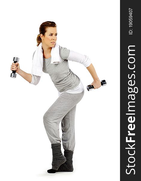 Girl exercising with weights, on a white background. Girl exercising with weights, on a white background