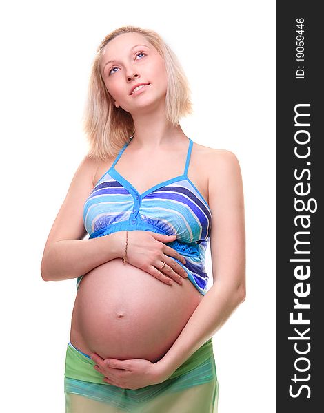 Beautiful young pregnant blonde woman in studio. Beautiful young pregnant blonde woman in studio