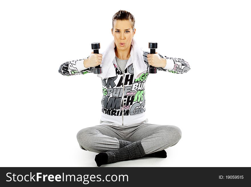 Girl exercising with weights, on a white background. Girl exercising with weights, on a white background