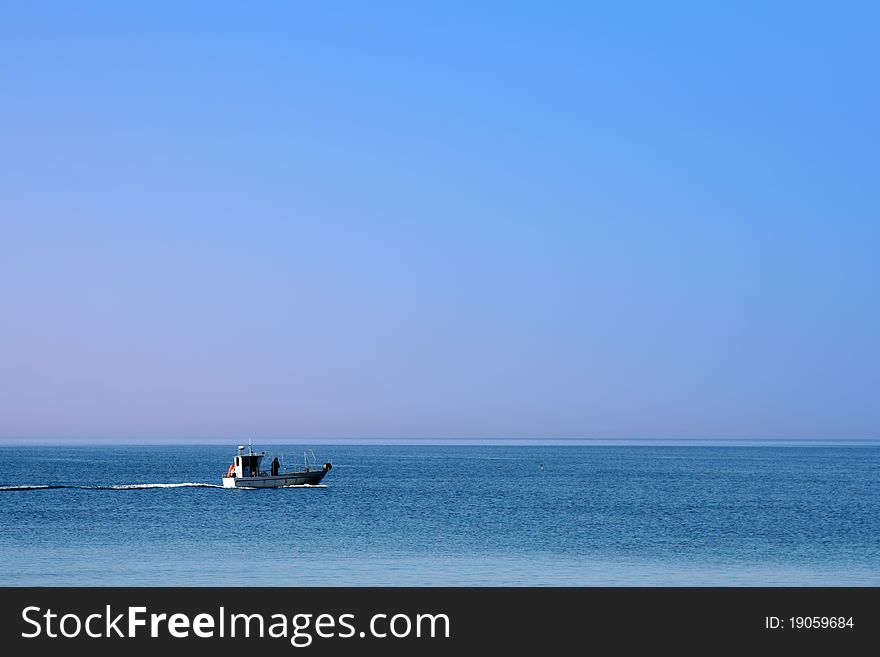 Fishing in the blue sea in summer