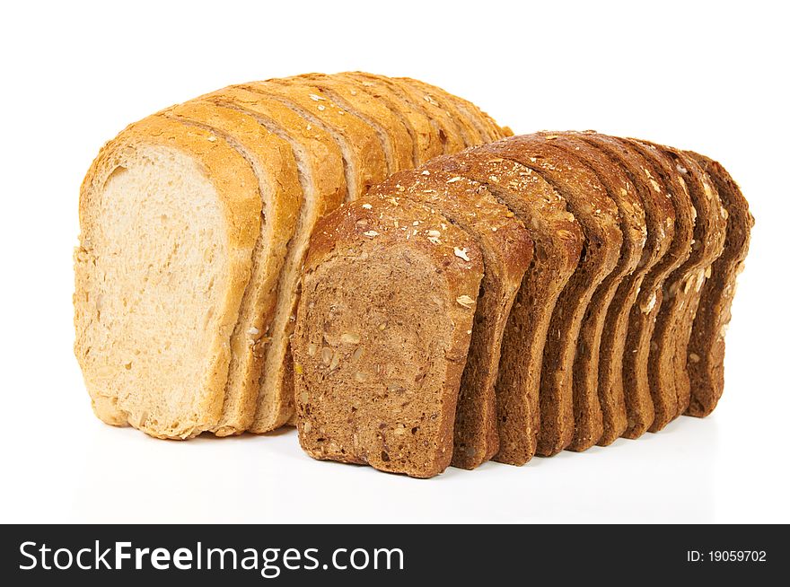 Two loaves of light and dark bread isolated on white. Two loaves of light and dark bread isolated on white