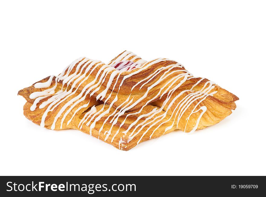 Sweet glazed roll with cherry jam isolated on white background. Sweet glazed roll with cherry jam isolated on white background