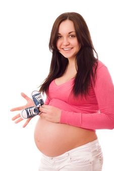 A Pregnant Woman Holding Baby Shoes Stock Image A Pregnant Woman Holding Baby Shoes Stock Image