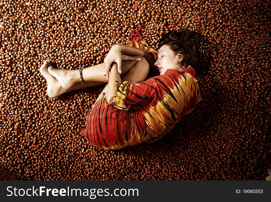 Girl Sleeping On A Hazelnuts