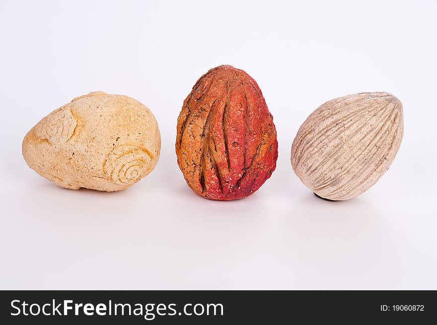 Three different colored stones on white background. Three different colored stones on white background
