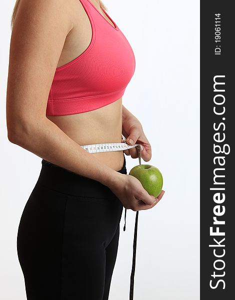 Woman With Green Apple And Measure Tape