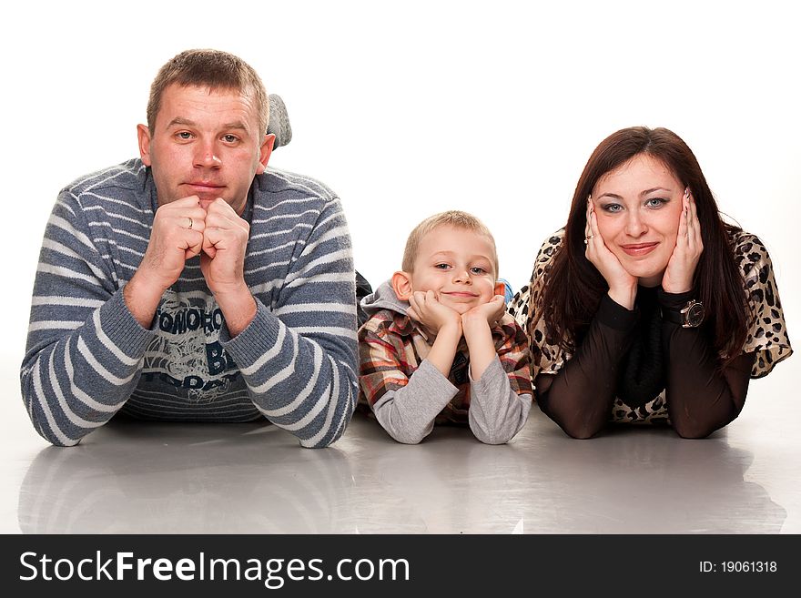 Portrait of a young happy smiling family isolated on white