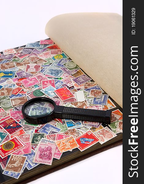 Stamp album with magnifying lens. Stamp album with magnifying lens