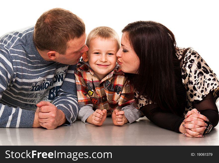 Portrait of a young happy smiling family isolated on white