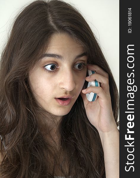 Teenager girl talking on a mobile phone. Teenager girl talking on a mobile phone
