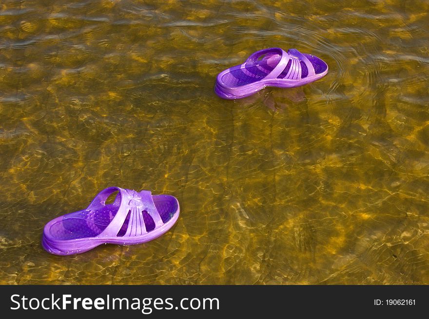 Sneaker floating on the water. Sneaker floating on the water.