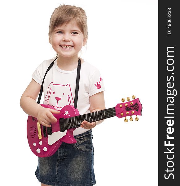 Little girl playing toy pink electric guitar on white