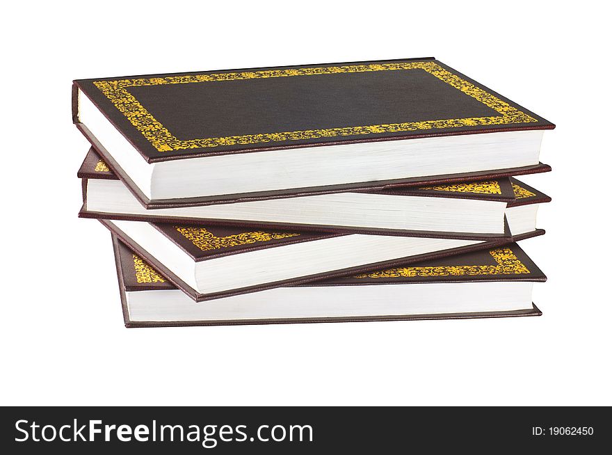 Group of four books in brown cover with gold ornamental pattern. Group of four books in brown cover with gold ornamental pattern