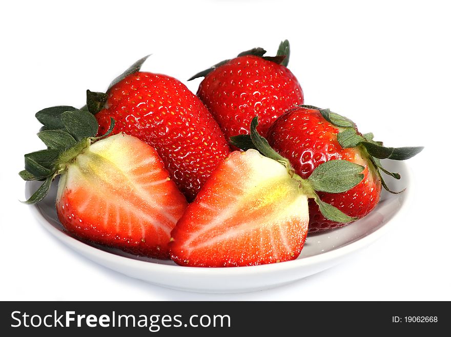Some beautiful red strawberries on a plate over white background. Some beautiful red strawberries on a plate over white background