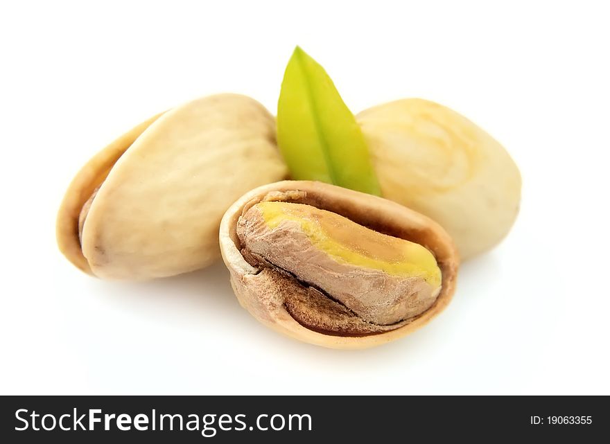 Dried pistachios on a white background