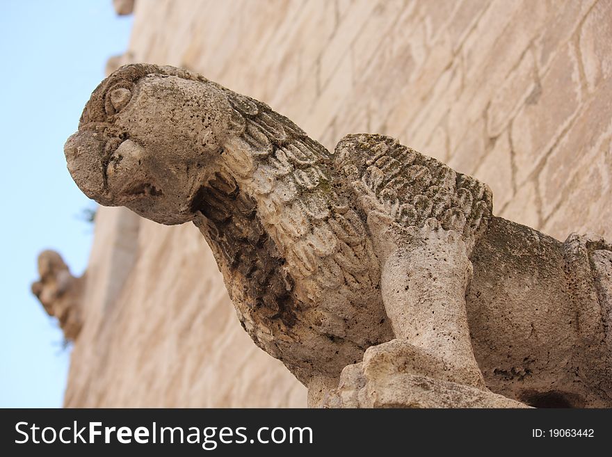 Detail of a griffin on the facade of the church of San Giacomo - Trani, Italy