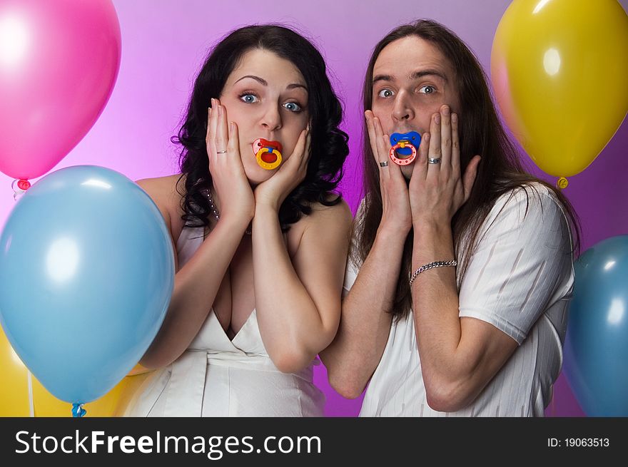 Funny pregnant couple with dummies