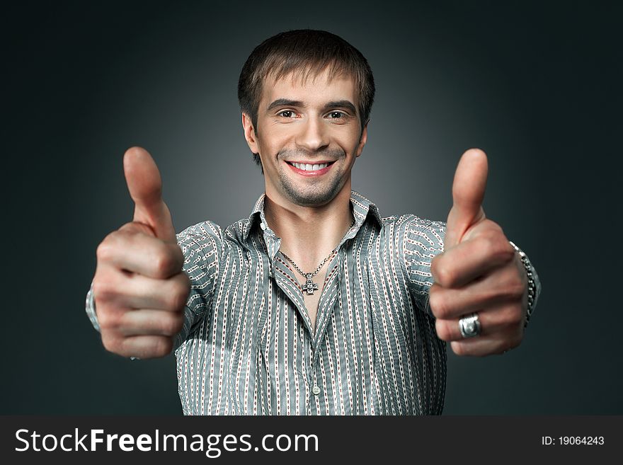 Young Happy Man Going Thumbs Up