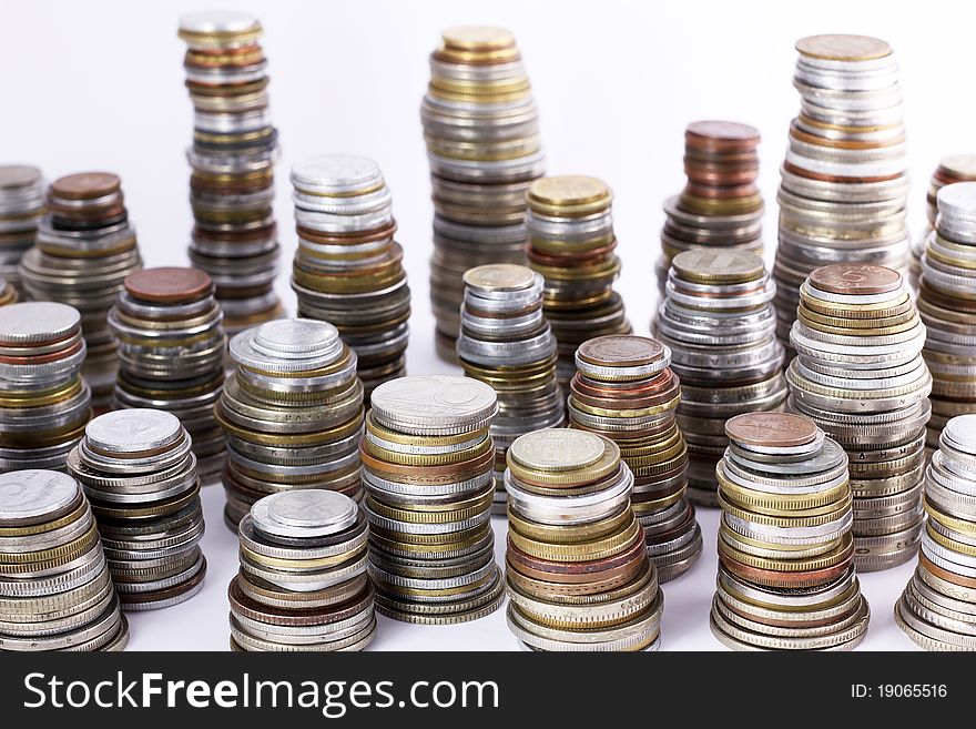 Stacks of various world coins. Stacks of various world coins