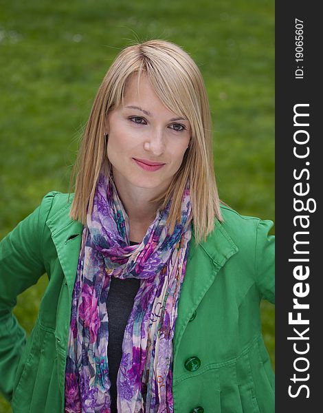 Young attractive woman casually dressed portraited in the park. Young attractive woman casually dressed portraited in the park