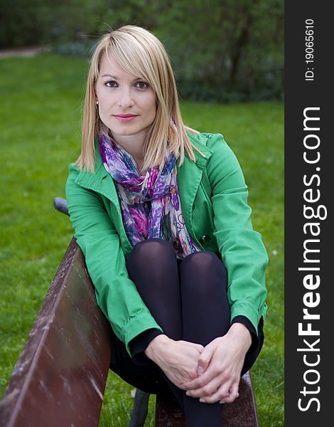 Young attractive woman casually dressed portraited in the park. Young attractive woman casually dressed portraited in the park