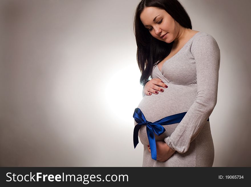 Portrait of joyful beautiful pregnant woman