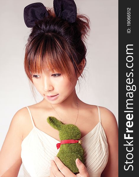 Celebrate Easter, a girl holding a toy rabbit. Celebrate Easter, a girl holding a toy rabbit.