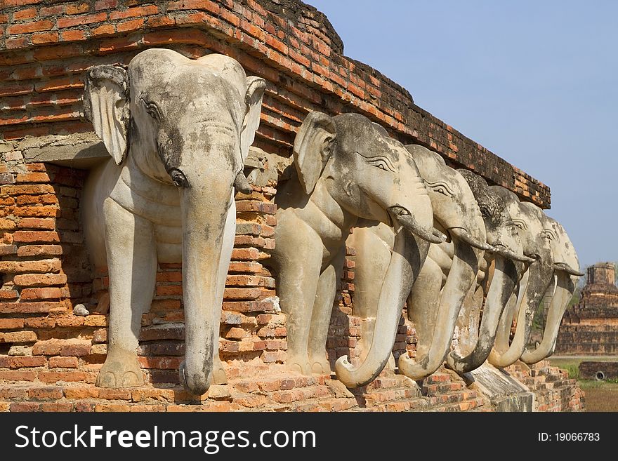 Elephant statues around the stupa at Sukhothai, Thailand