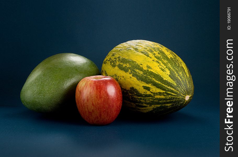 Selection of tropical fruits - mango, melon, apple. Selection of tropical fruits - mango, melon, apple