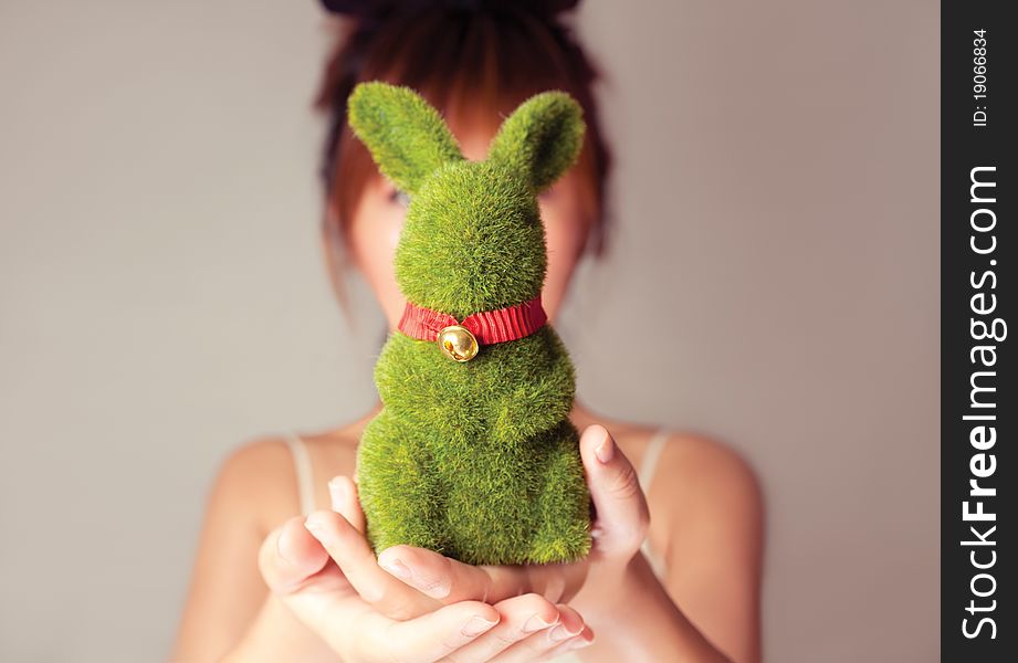 Celebrate Easter, a girl holding a toy rabbit. Celebrate Easter, a girl holding a toy rabbit.