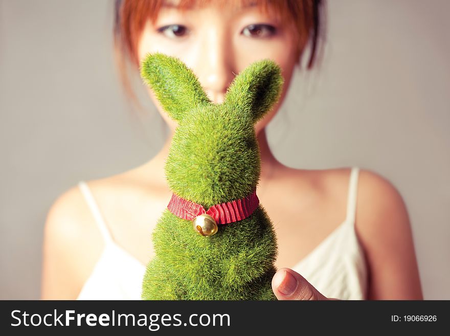 Celebrate Easter, a girl holding a toy rabbit. Celebrate Easter, a girl holding a toy rabbit.