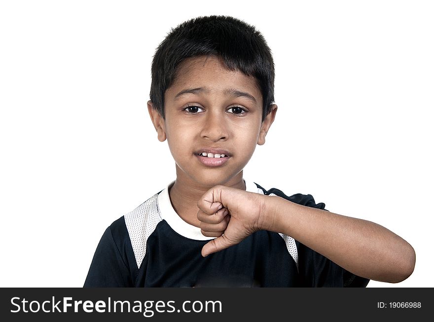 An handsome young indian kid showing thumbs down