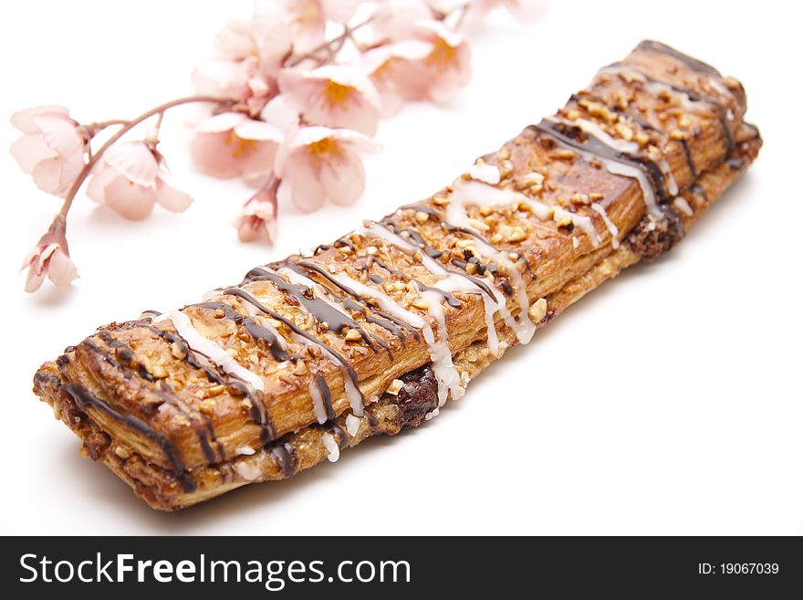 Nut pastry with chocolate onto white background