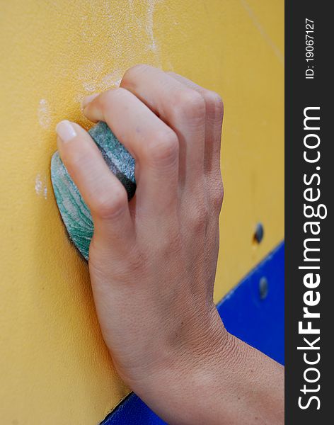 Close up of a left hand of a woman on a socket. Close up of a left hand of a woman on a socket