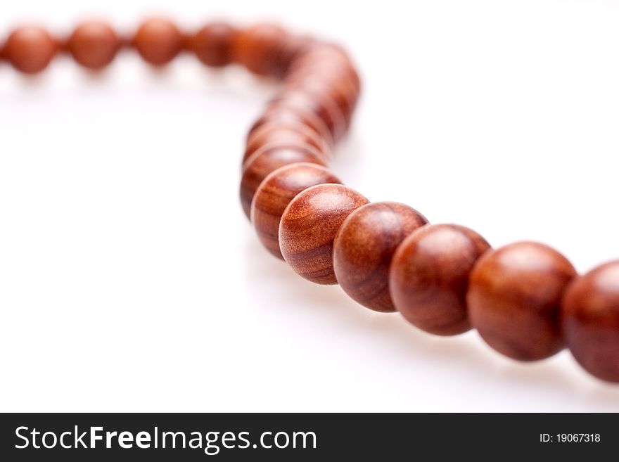 Wooden beads on a white background