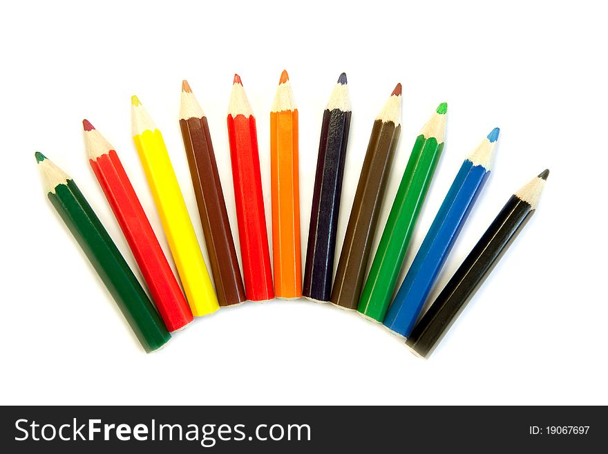 Row of colored pencils on white background. Row of colored pencils on white background
