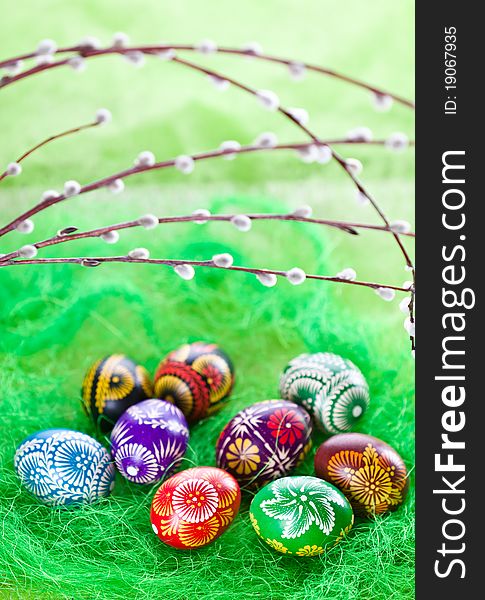 Hand painted easter eggs on green background