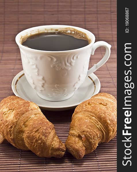 Croissant and coffe in the photo. Croissant and coffe in the photo