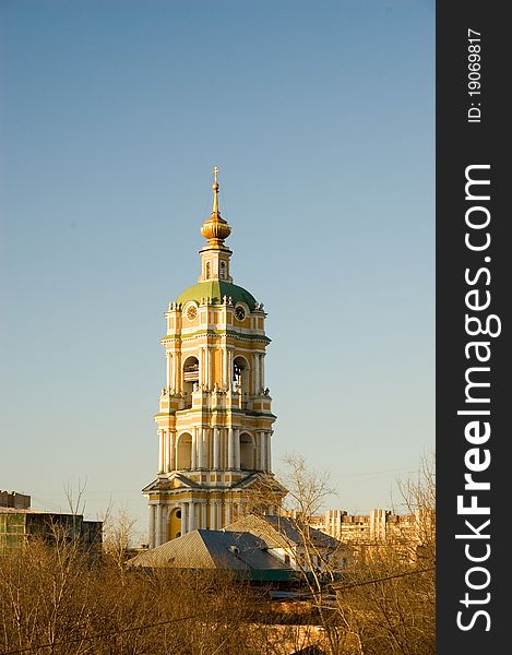 View on belfry of the Novospassky monastery at sunset in Moscow