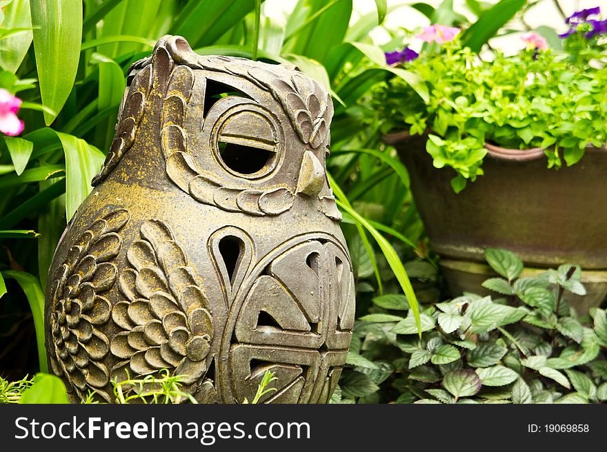 Clay owl in the garden