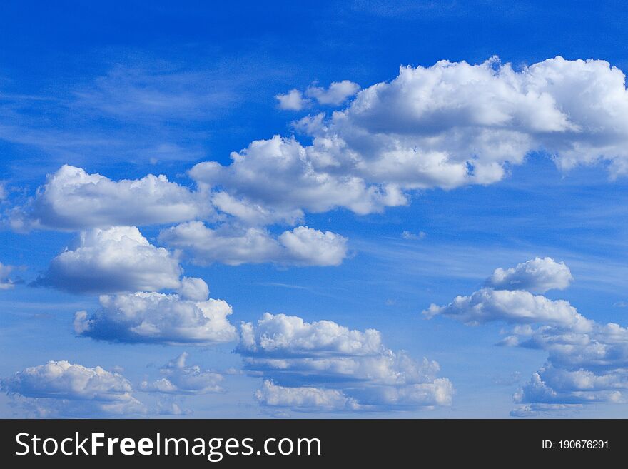 Fluffy clouds in the blue sky, beautiful summer sky