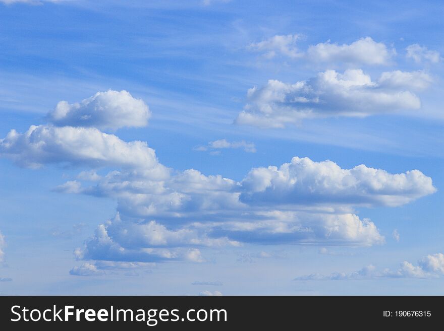 Fluffy clouds in the blue sky, beautiful summer sky