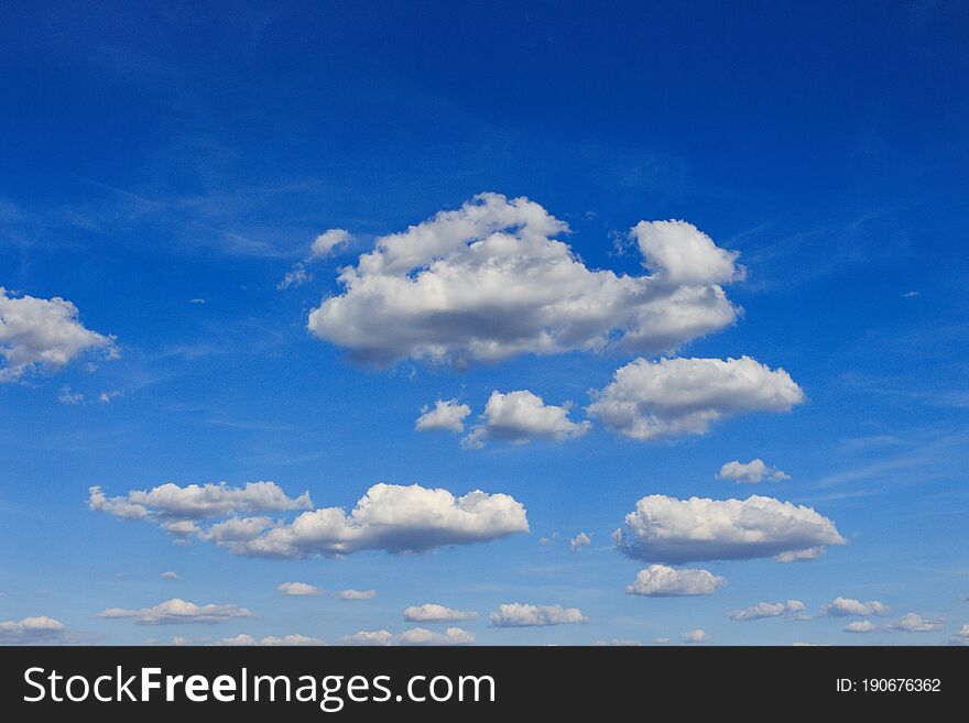 Fluffy clouds in the blue sky, beautiful summer sky