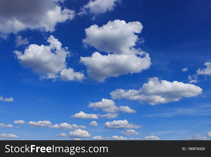 Fluffy clouds in the blue sky, beautiful summer sky