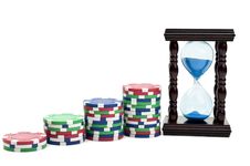Hourglass And Poker Chips Stock Photography